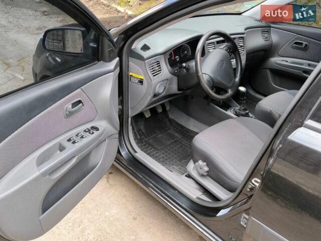 Чорний Кіа Ріо, об'ємом двигуна 1.4 л та пробігом 198 тис. км за 5200 $, фото 6 на Automoto.ua