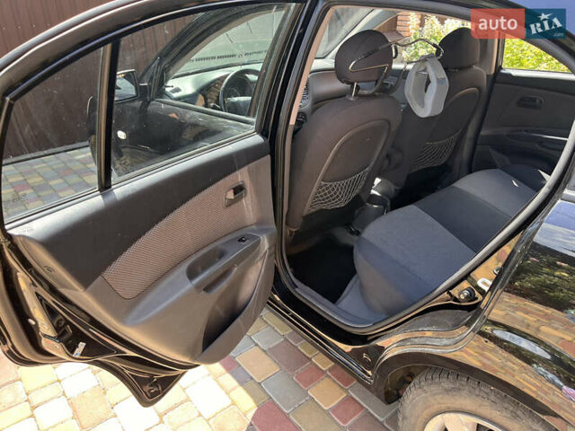 Черный Киа Рио, объемом двигателя 1.4 л и пробегом 174 тыс. км за 4200 $, фото 21 на Automoto.ua