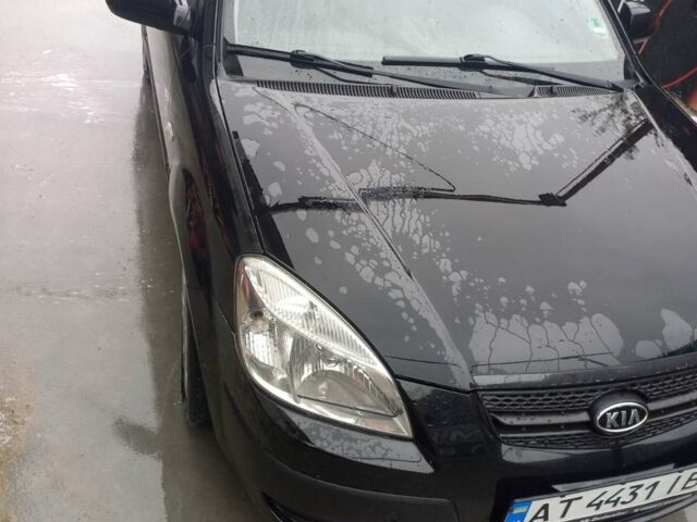 Чорний Кіа Ріо, об'ємом двигуна 1.4 л та пробігом 230 тис. км за 5248 $, фото 9 на Automoto.ua