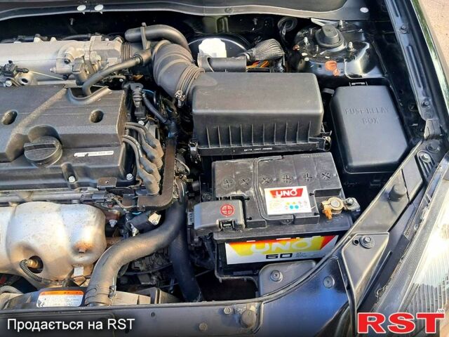 Черный Киа Рио, объемом двигателя 1.4 л и пробегом 107 тыс. км за 5000 $, фото 1 на Automoto.ua