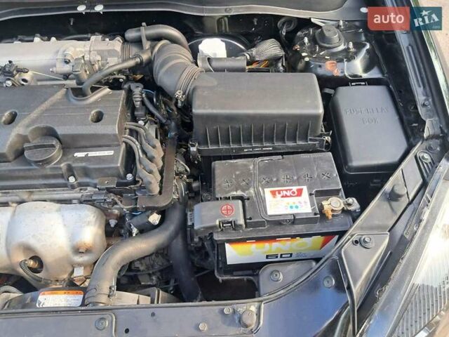 Чорний Кіа Ріо, об'ємом двигуна 1.4 л та пробігом 107 тис. км за 5000 $, фото 4 на Automoto.ua