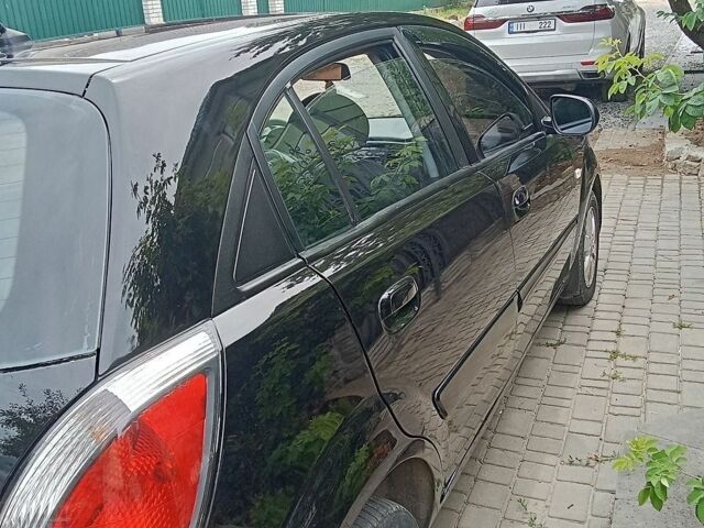 Чорний Кіа Ріо, об'ємом двигуна 1.4 л та пробігом 274 тис. км за 5800 $, фото 3 на Automoto.ua