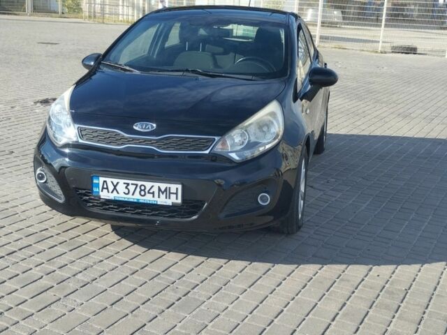 Чорний Кіа Ріо, об'ємом двигуна 1.25 л та пробігом 210 тис. км за 6500 $, фото 2 на Automoto.ua