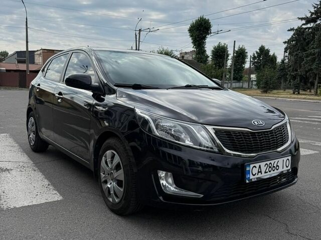 Черный Киа Рио, объемом двигателя 1.59 л и пробегом 127 тыс. км за 7600 $, фото 1 на Automoto.ua