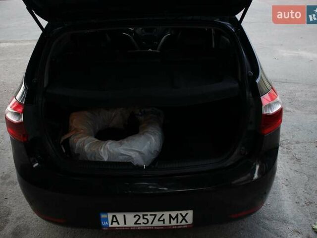 Чорний Кіа Ріо, об'ємом двигуна 1.6 л та пробігом 217 тис. км за 6200 $, фото 1 на Automoto.ua