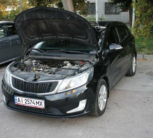 Чорний Кіа Ріо, об'ємом двигуна 1.6 л та пробігом 217 тис. км за 6200 $, фото 4 на Automoto.ua