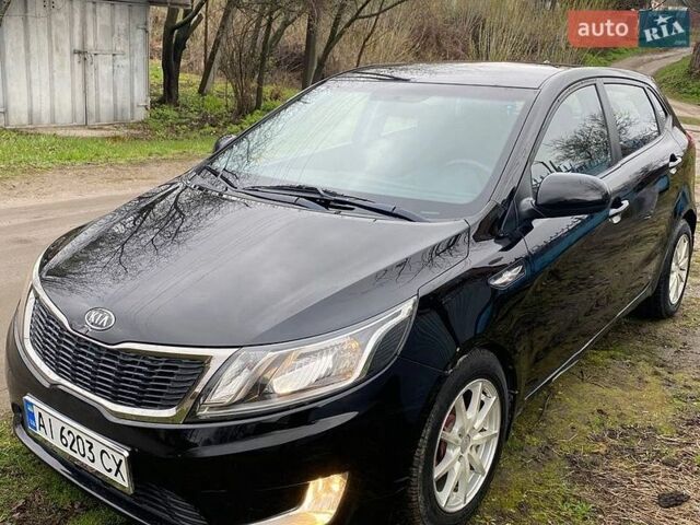 Черный Киа Рио, объемом двигателя 1.4 л и пробегом 170 тыс. км за 6700 $, фото 1 на Automoto.ua