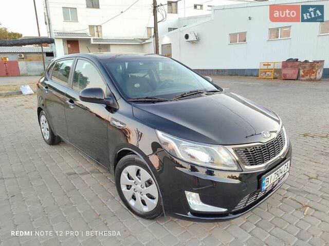 Чорний Кіа Ріо, об'ємом двигуна 1.4 л та пробігом 42 тис. км за 8200 $, фото 14 на Automoto.ua