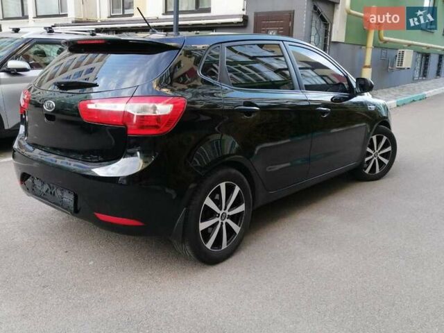 Черный Киа Рио, объемом двигателя 1.6 л и пробегом 156 тыс. км за 7950 $, фото 1 на Automoto.ua