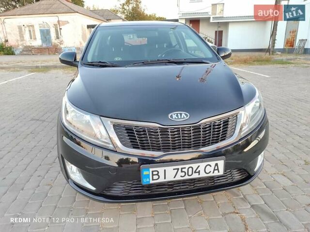 Чорний Кіа Ріо, об'ємом двигуна 1.4 л та пробігом 42 тис. км за 8200 $, фото 5 на Automoto.ua