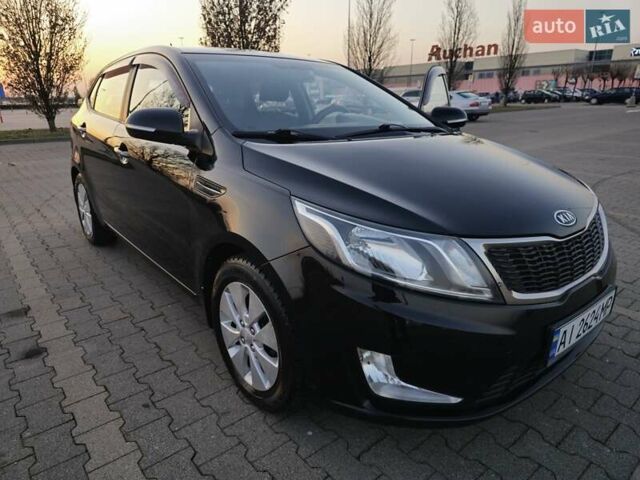 Черный Киа Рио, объемом двигателя 1.59 л и пробегом 137 тыс. км за 7750 $, фото 1 на Automoto.ua