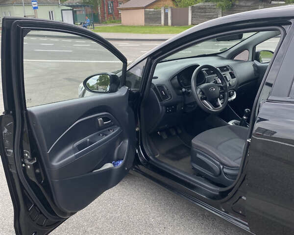 Чорний Кіа Ріо, об'ємом двигуна 1.2 л та пробігом 200 тис. км за 5700 $, фото 8 на Automoto.ua