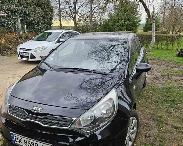 Чорний Кіа Ріо, об'ємом двигуна 1.1 л та пробігом 143 тис. км за 6830 $, фото 1 на Automoto.ua