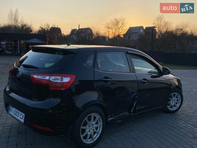 Чорний Кіа Ріо, об'ємом двигуна 1.4 л та пробігом 169 тис. км за 4499 $, фото 6 на Automoto.ua
