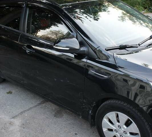 Чорний Кіа Ріо, об'ємом двигуна 1.6 л та пробігом 217 тис. км за 6200 $, фото 7 на Automoto.ua