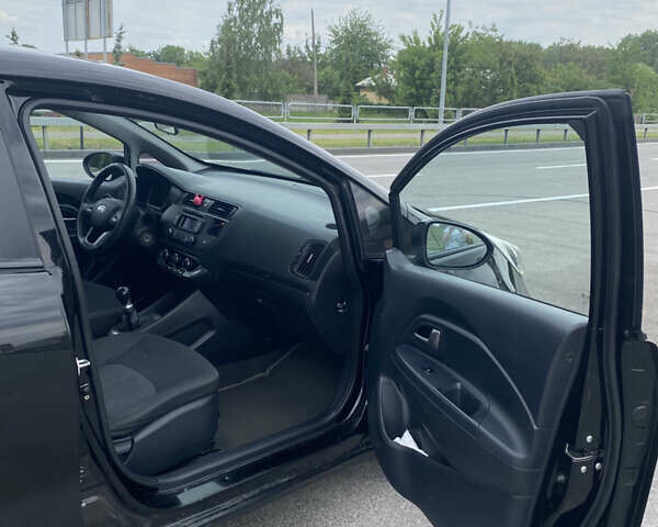 Чорний Кіа Ріо, об'ємом двигуна 1.2 л та пробігом 200 тис. км за 5700 $, фото 3 на Automoto.ua