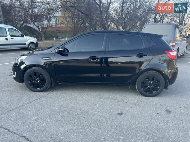 Черный Киа Рио, объемом двигателя 1.59 л и пробегом 107 тыс. км за 8300 $, фото 1 на Automoto.ua