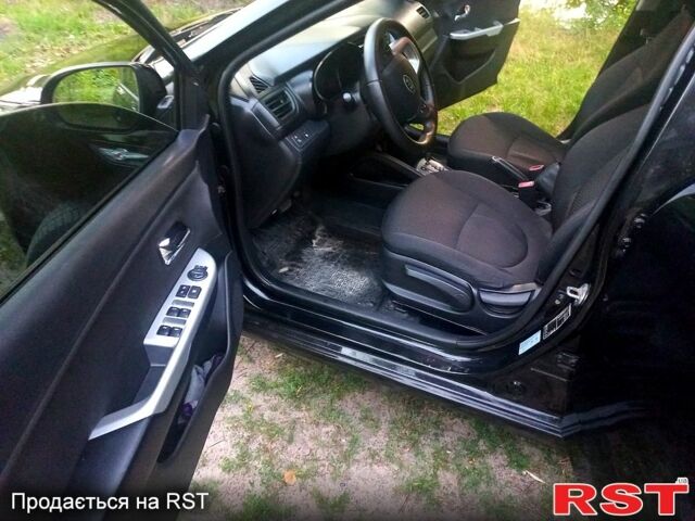 Чорний Кіа Ріо, об'ємом двигуна 1.6 л та пробігом 113 тис. км за 8500 $, фото 6 на Automoto.ua