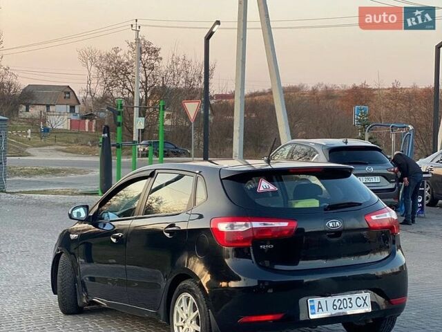 Черный Киа Рио, объемом двигателя 1.4 л и пробегом 170 тыс. км за 6700 $, фото 3 на Automoto.ua