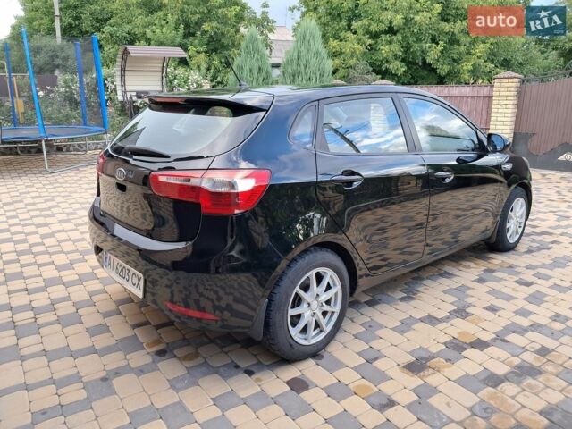 Черный Киа Рио, объемом двигателя 1.4 л и пробегом 172 тыс. км за 5700 $, фото 4 на Automoto.ua