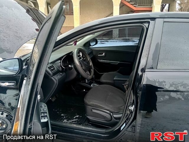 Чорний Кіа Ріо, об'ємом двигуна 1.6 л та пробігом 16000 тис. км за 7800 $, фото 7 на Automoto.ua