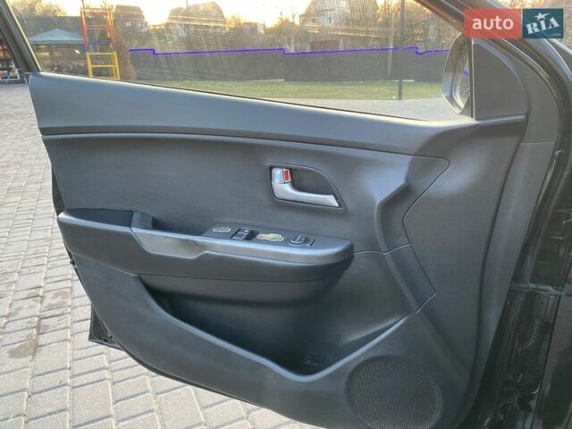 Чорний Кіа Ріо, об'ємом двигуна 1.4 л та пробігом 169 тис. км за 4499 $, фото 11 на Automoto.ua