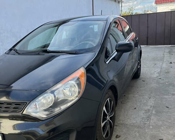 Черный Киа Рио, объемом двигателя 1.6 л и пробегом 280 тыс. км за 7700 $, фото 1 на Automoto.ua