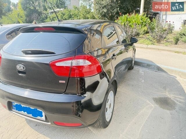 Черный Киа Рио, объемом двигателя 1.59 л и пробегом 133 тыс. км за 7200 $, фото 1 на Automoto.ua