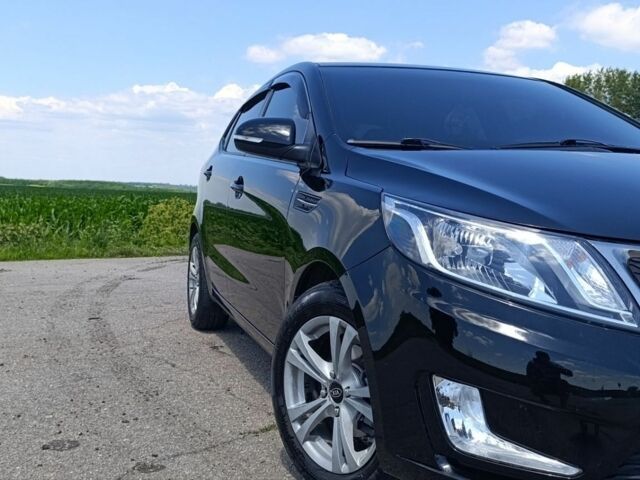 Черный Киа Рио, объемом двигателя 1.59 л и пробегом 67 тыс. км за 8500 $, фото 1 на Automoto.ua