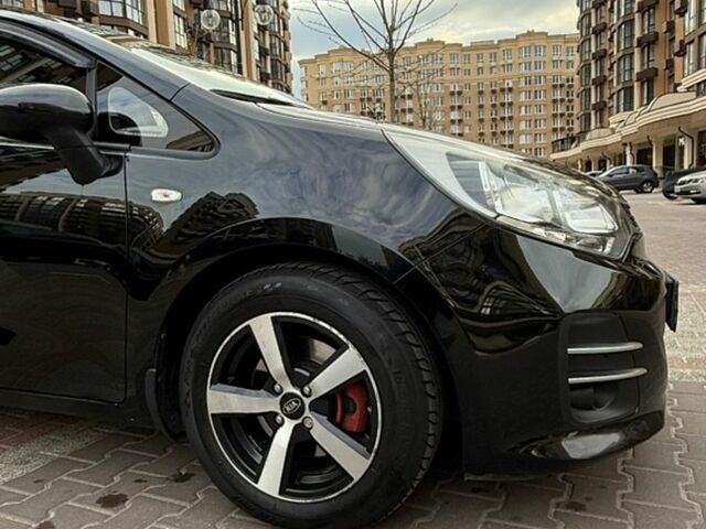 Чорний Кіа Ріо, об'ємом двигуна 1.4 л та пробігом 74 тис. км за 12500 $, фото 11 на Automoto.ua