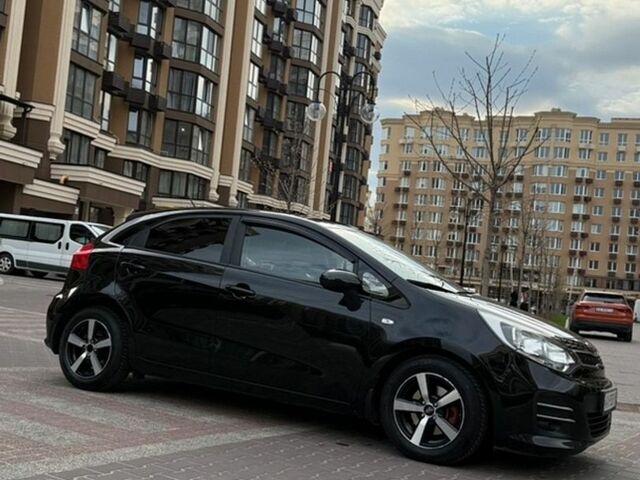 Чорний Кіа Ріо, об'ємом двигуна 1.4 л та пробігом 74 тис. км за 12500 $, фото 6 на Automoto.ua