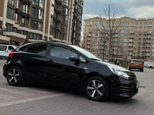 Чорний Кіа Ріо, об'ємом двигуна 1.4 л та пробігом 74 тис. км за 12500 $, фото 1 на Automoto.ua