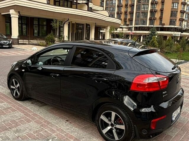 Чорний Кіа Ріо, об'ємом двигуна 1.4 л та пробігом 74 тис. км за 12500 $, фото 12 на Automoto.ua