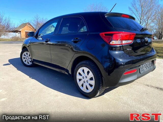 Чорний Кіа Ріо, об'ємом двигуна 1.4 л та пробігом 89 тис. км за 12700 $, фото 3 на Automoto.ua