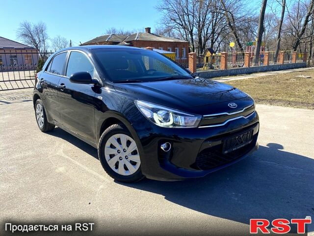 Чорний Кіа Ріо, об'ємом двигуна 1.4 л та пробігом 89 тис. км за 12700 $, фото 1 на Automoto.ua