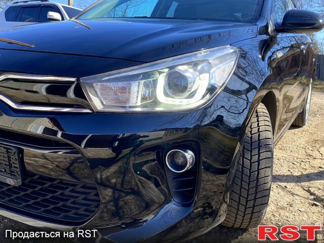 Чорний Кіа Ріо, об'ємом двигуна 1.4 л та пробігом 211 тис. км за 12700 $, фото 2 на Automoto.ua