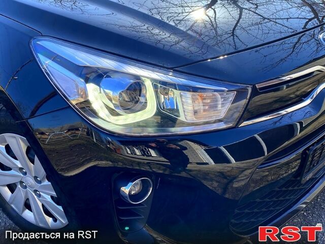 Чорний Кіа Ріо, об'ємом двигуна 1.4 л та пробігом 89 тис. км за 12700 $, фото 10 на Automoto.ua