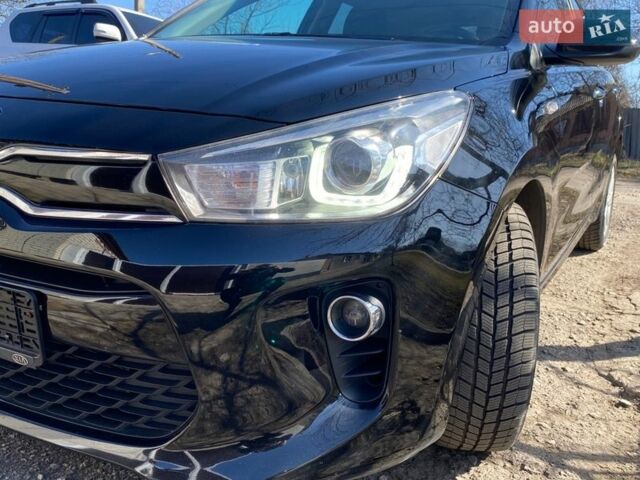 Чорний Кіа Ріо, об'ємом двигуна 1.4 л та пробігом 89 тис. км за 12700 $, фото 19 на Automoto.ua