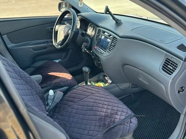 Чорний Кіа Ріо, об'ємом двигуна 1.4 л та пробігом 213 тис. км за 5100 $, фото 27 на Automoto.ua