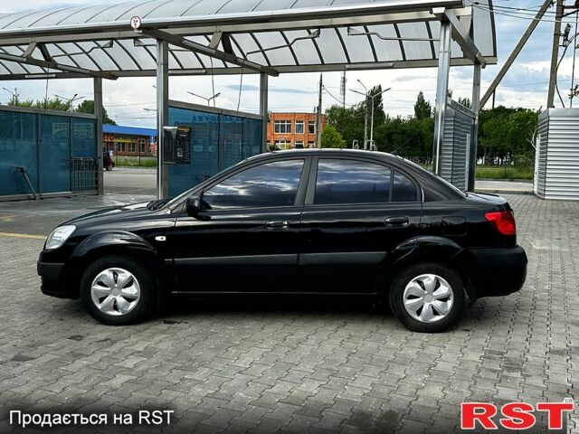 Черный Киа Рио, объемом двигателя 1.4 л и пробегом 250 тыс. км за 4999 $, фото 1 на Automoto.ua