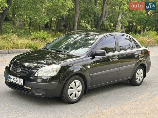 Чорний Кіа Ріо, об'ємом двигуна 1.4 л та пробігом 252 тис. км за 4750 $, фото 1 на Automoto.ua