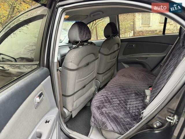 Чорний Кіа Ріо, об'ємом двигуна 1.4 л та пробігом 200 тис. км за 5000 $, фото 4 на Automoto.ua