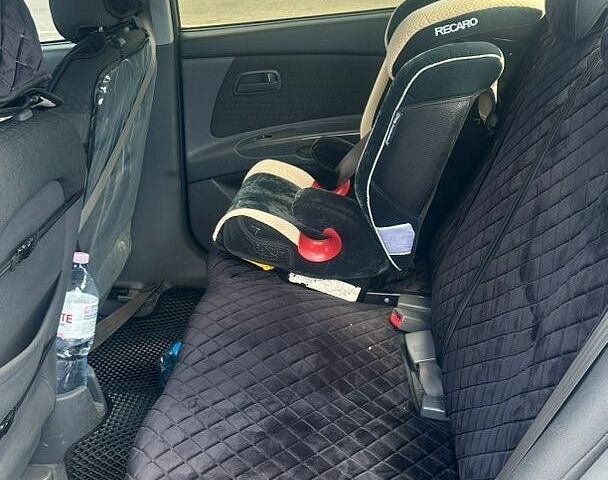 Чорний Кіа Ріо, об'ємом двигуна 1.4 л та пробігом 213 тис. км за 5100 $, фото 10 на Automoto.ua