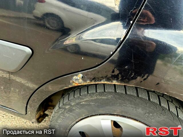 Черный Киа Рио, объемом двигателя 1.4 л и пробегом 252 тыс. км за 3600 $, фото 7 на Automoto.ua