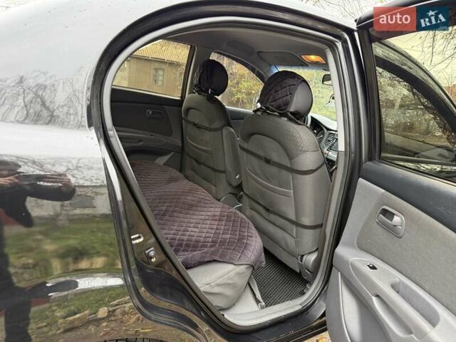 Чорний Кіа Ріо, об'ємом двигуна 1.4 л та пробігом 200 тис. км за 5000 $, фото 6 на Automoto.ua