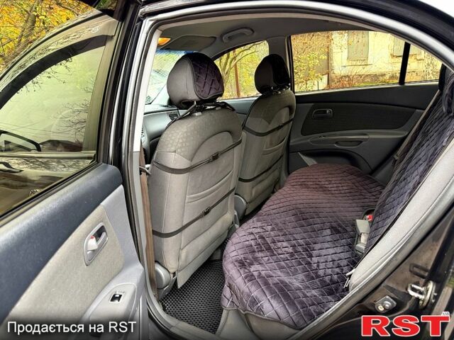 Черный Киа Рио, объемом двигателя 1.4 л и пробегом 199 тыс. км за 5500 $, фото 1 на Automoto.ua