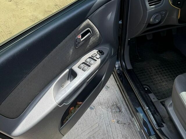 Чорний Кіа Ріо, об'ємом двигуна 1.4 л та пробігом 135 тис. км за 5500 $, фото 13 на Automoto.ua