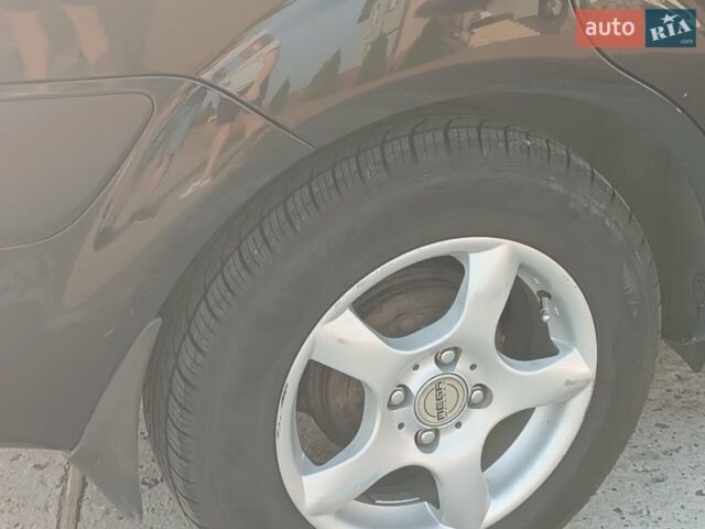 Черный Киа Рио, объемом двигателя 1.4 л и пробегом 196 тыс. км за 4200 $, фото 7 на Automoto.ua