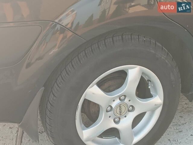 Черный Киа Рио, объемом двигателя 1.4 л и пробегом 196 тыс. км за 4200 $, фото 7 на Automoto.ua