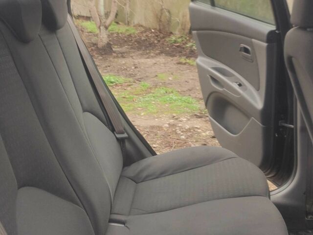 Черный Киа Рио, объемом двигателя 1.4 л и пробегом 229 тыс. км за 4200 $, фото 8 на Automoto.ua